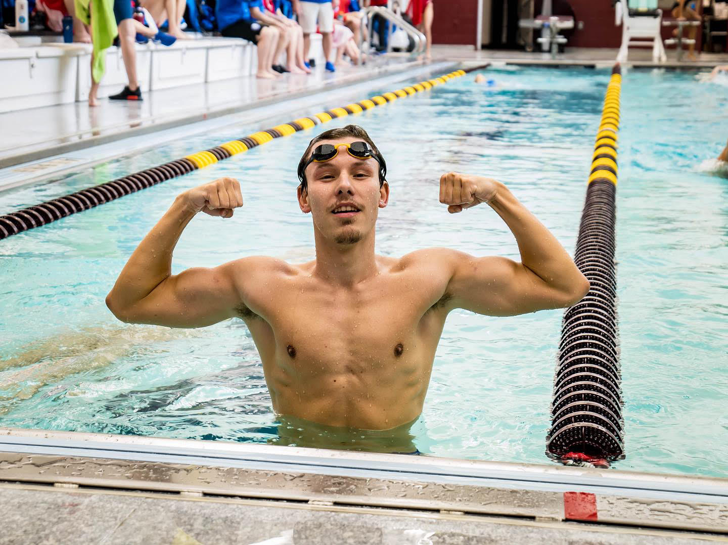 Benedek celebrates in the pool after a meet