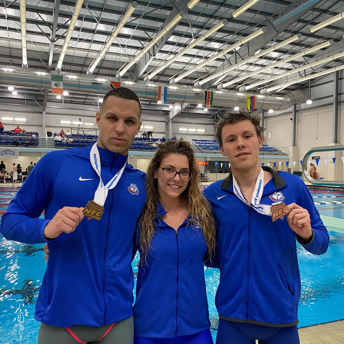 Benedek with teammates and medals at the NEC championships